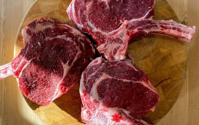 raw meat on brown wooden chopping board